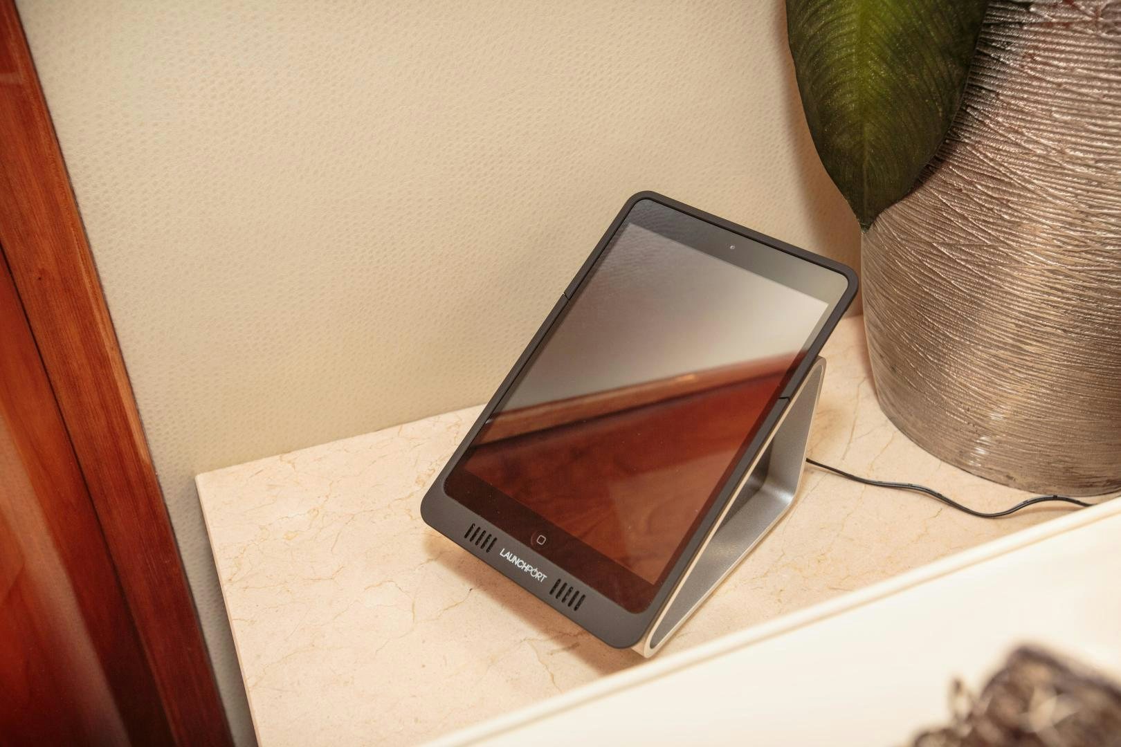 a cell phone on a table aboard STERLING V Yacht for Sale
