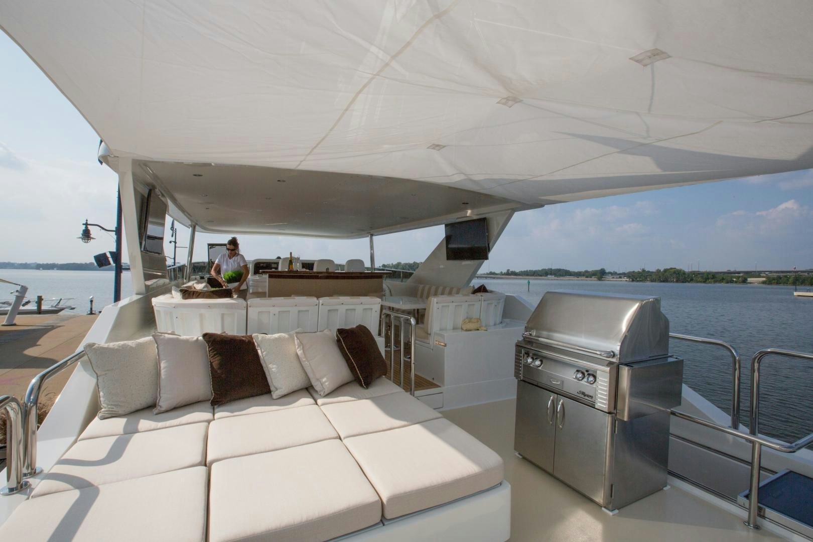 a boat with a bed and a table on it aboard STERLING V Yacht for Sale