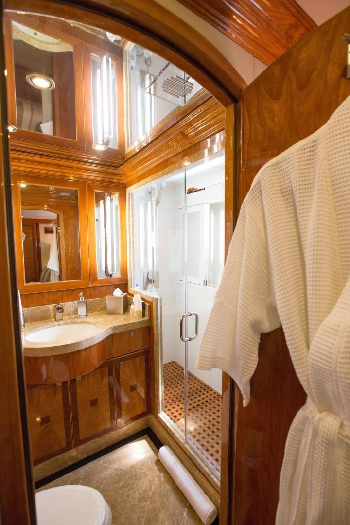 a bathroom with a sink and a mirror aboard STERLING V Yacht for Sale