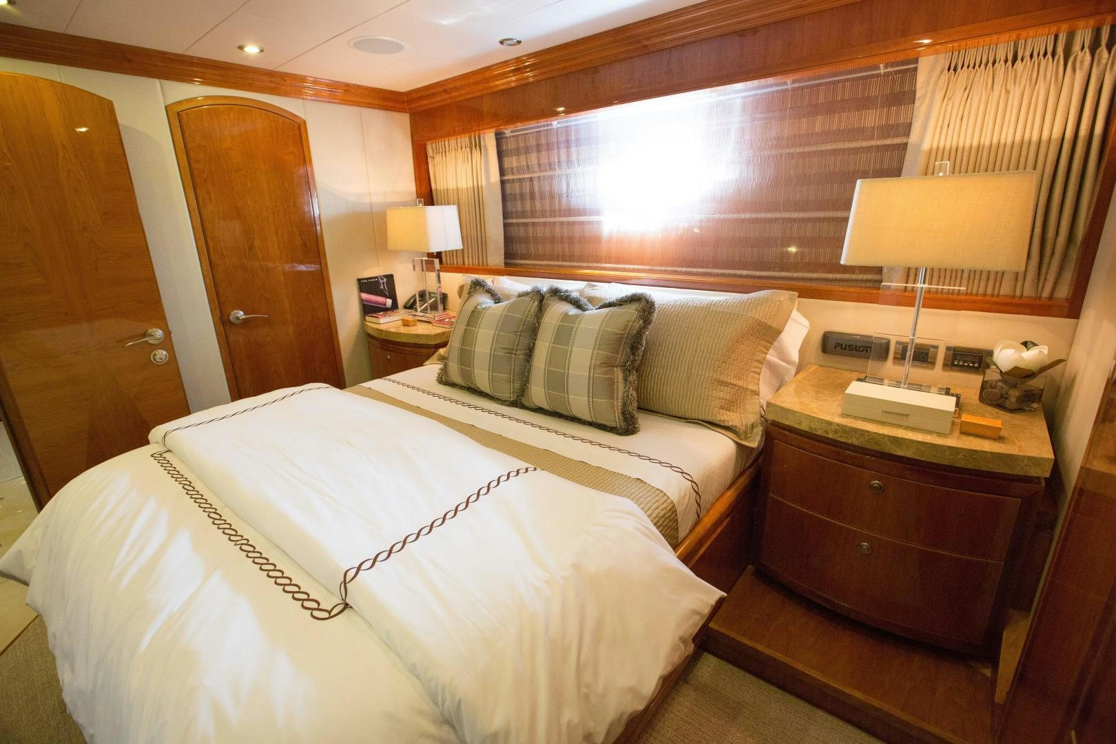 a hotel room with two beds aboard STERLING V Yacht for Sale