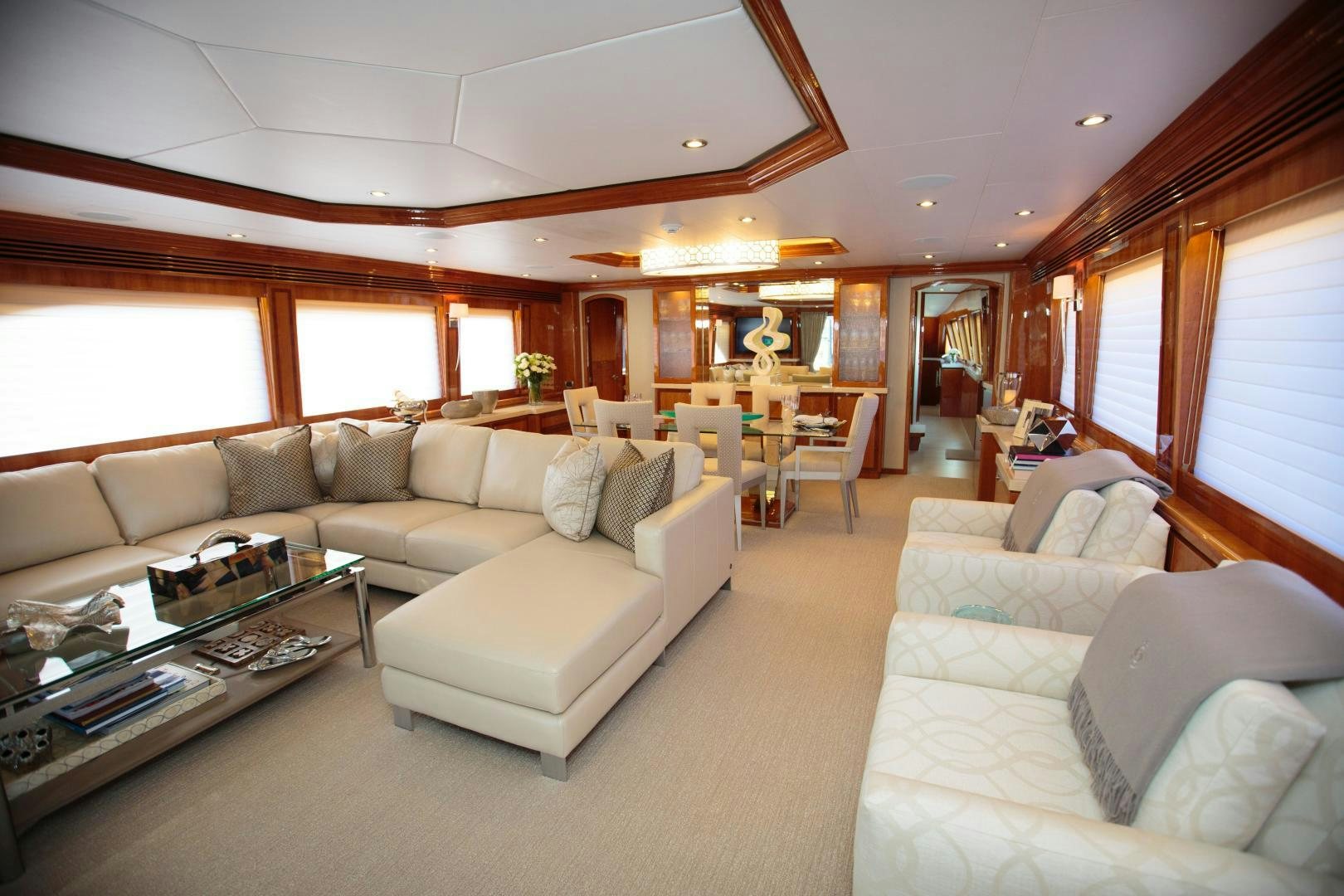 a living room with a couch and a coffee table aboard STERLING V Yacht for Sale