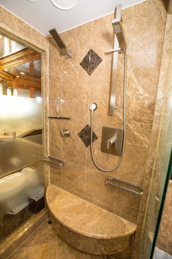 a bathroom with a glass shower aboard STERLING V Yacht for Sale