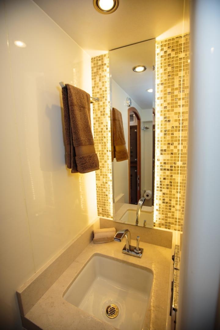 a bathroom with a sink and towels aboard STERLING V Yacht for Sale
