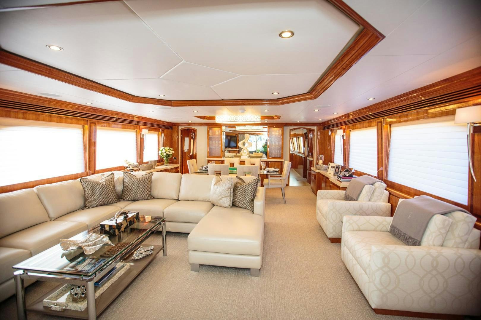 a living room with a couch and a coffee table aboard STERLING V Yacht for Sale