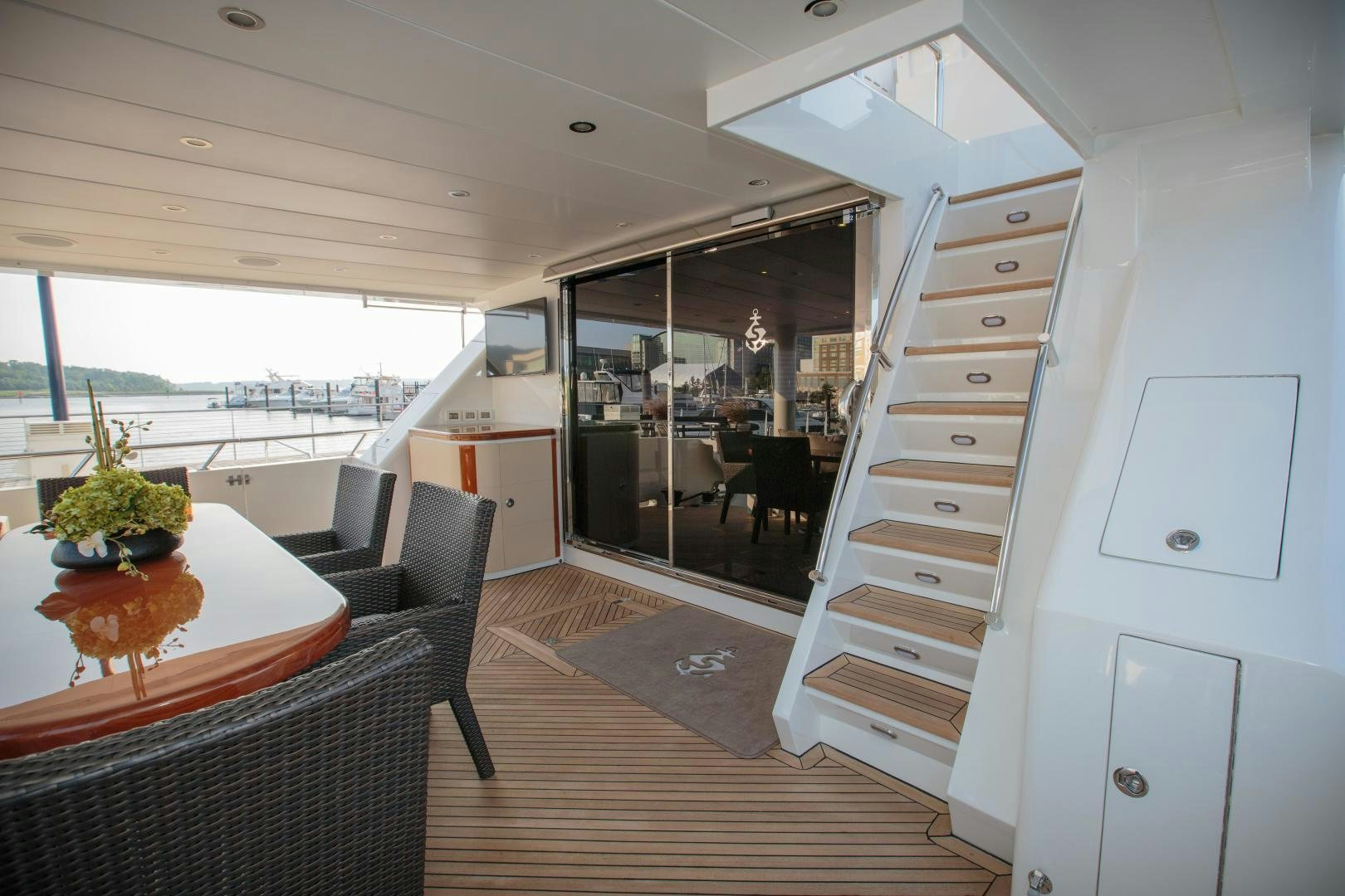 a room with a table and chairs aboard STERLING V Yacht for Sale