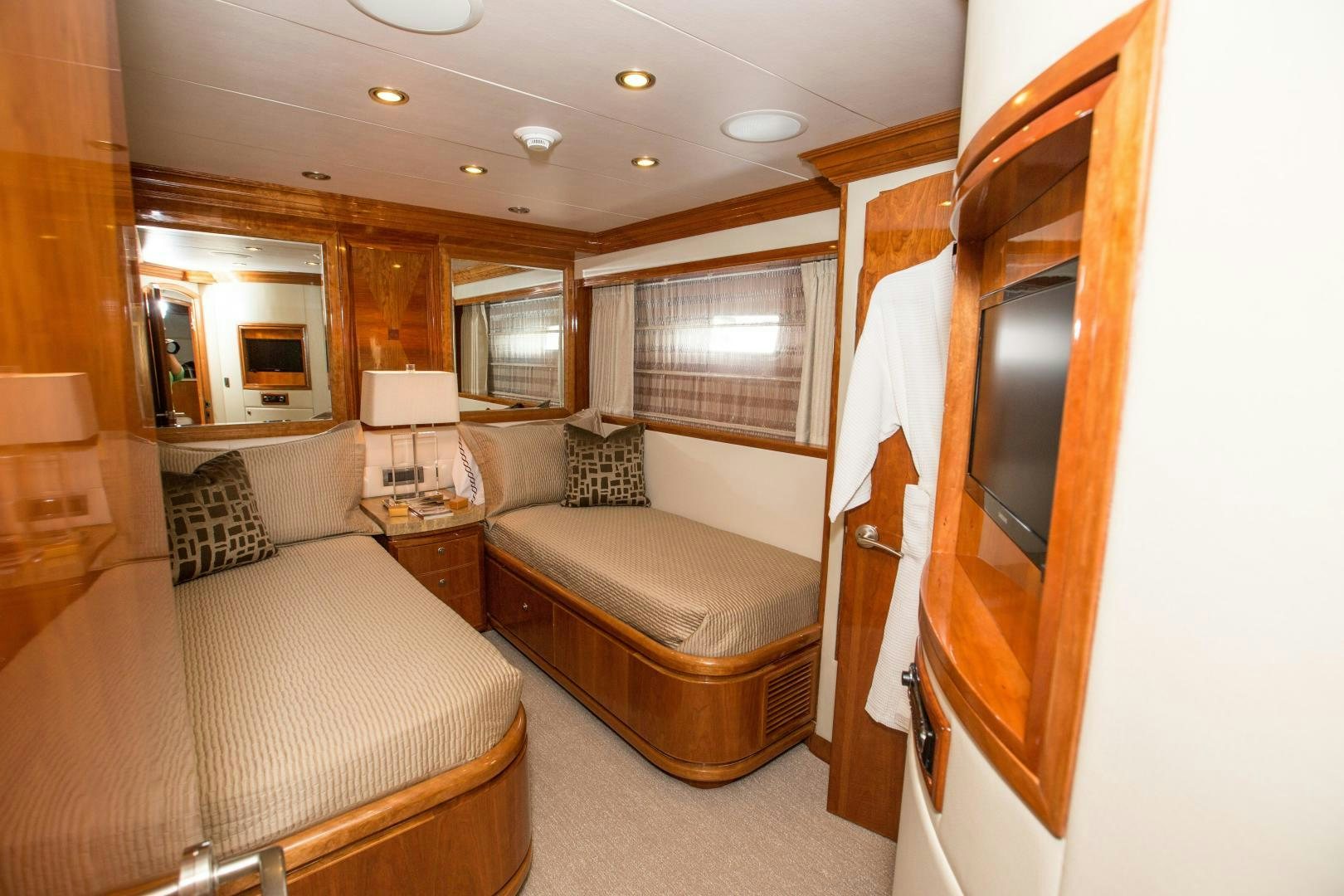 a bedroom with a bed and a couch aboard STERLING V Yacht for Sale