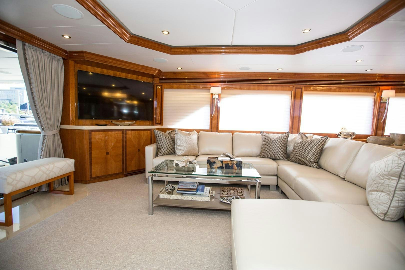 a living room with a large window aboard STERLING V Yacht for Sale
