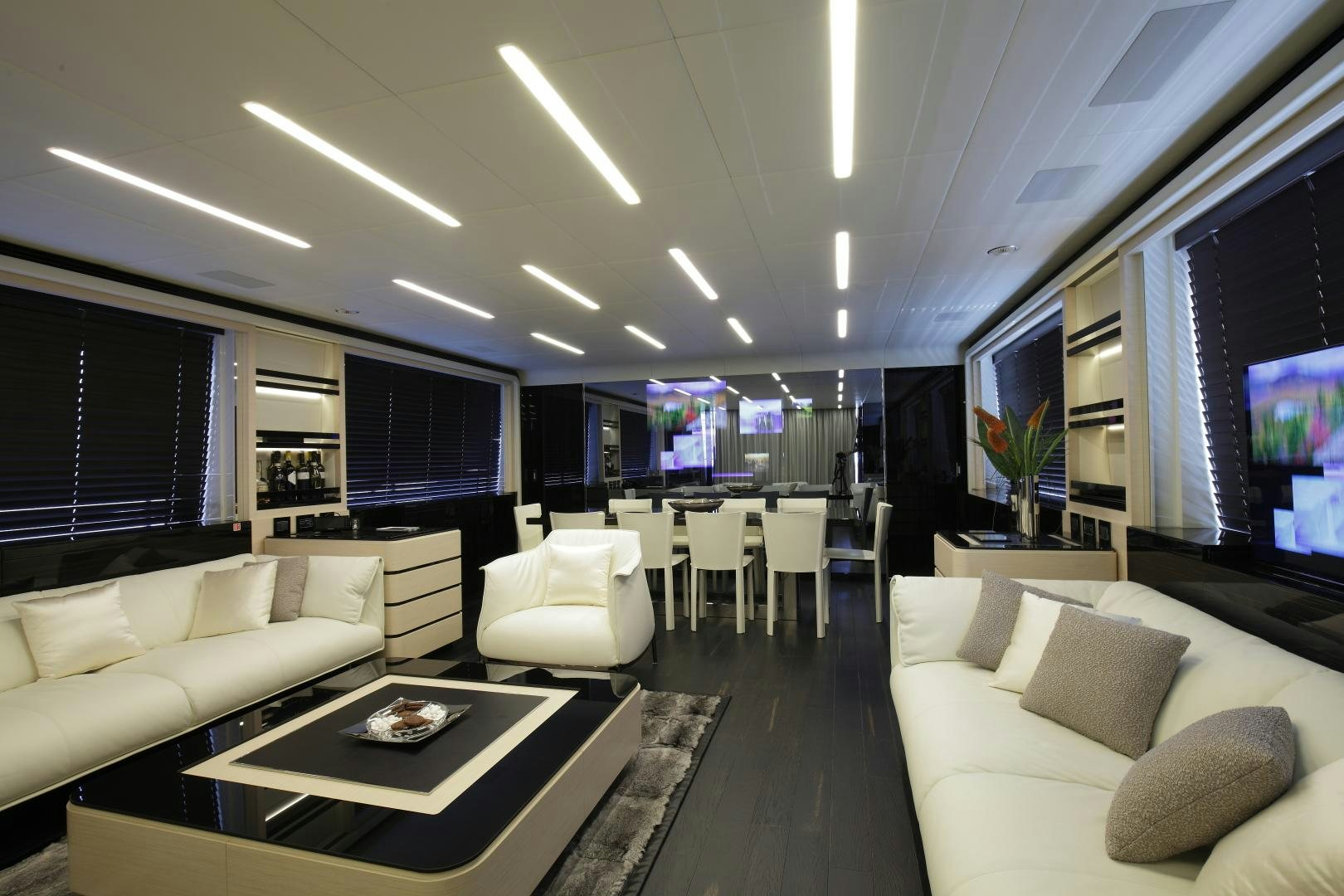 a living room with a large window aboard NOVASTAR Yacht for Sale