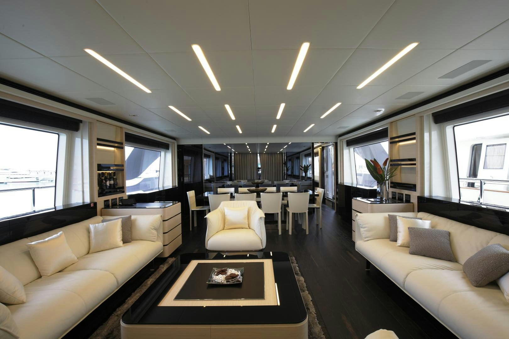 a living room with a couch and a coffee table aboard NOVASTAR Yacht for Sale