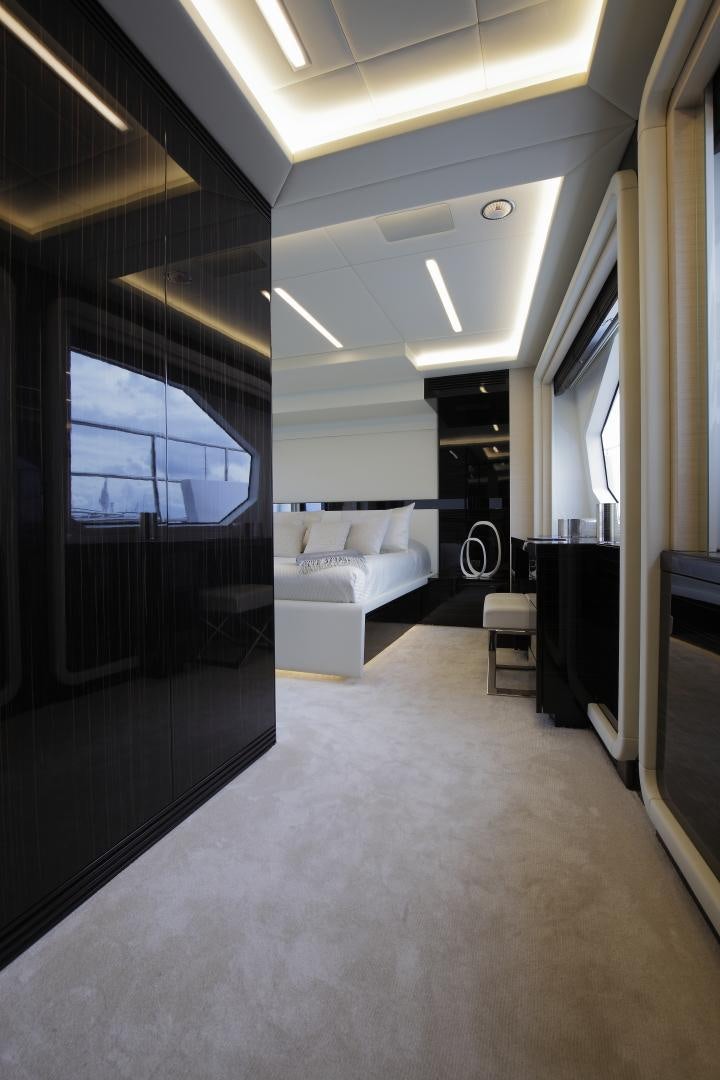 a room with a bed and a window aboard NOVASTAR Yacht for Sale