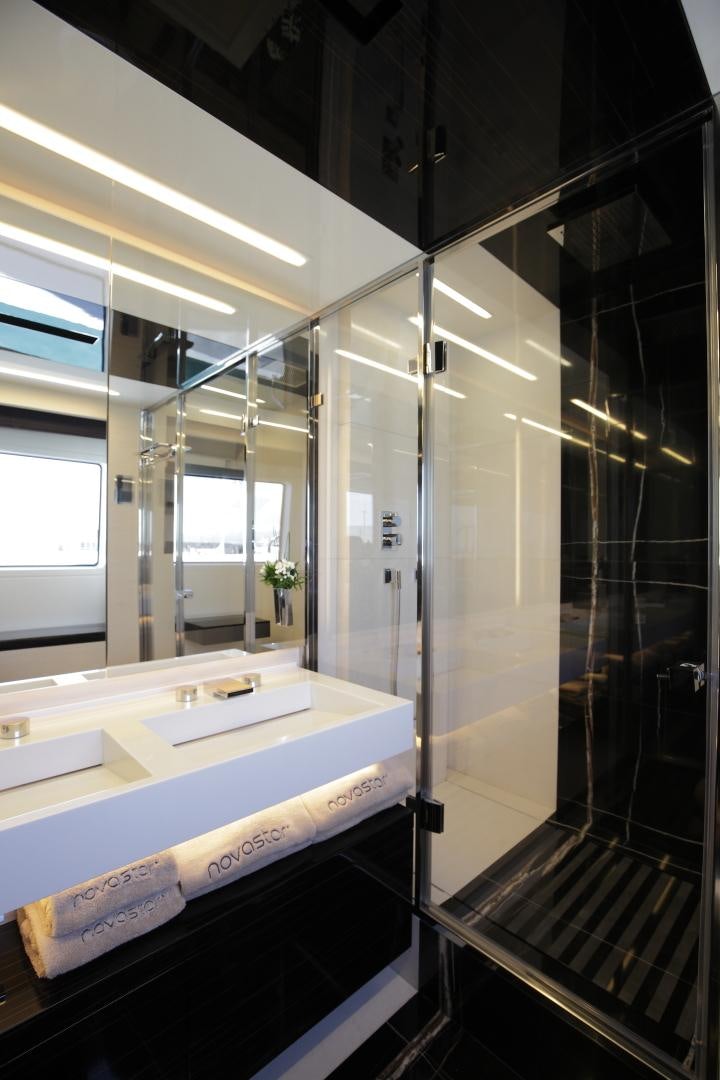 a bathroom with a large glass shower aboard NOVASTAR Yacht for Sale