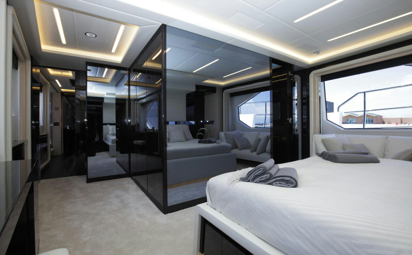 a room with a bed and a couch aboard NOVASTAR Yacht for Sale