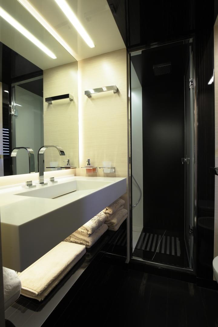 a bathroom with a large shower aboard NOVASTAR Yacht for Sale