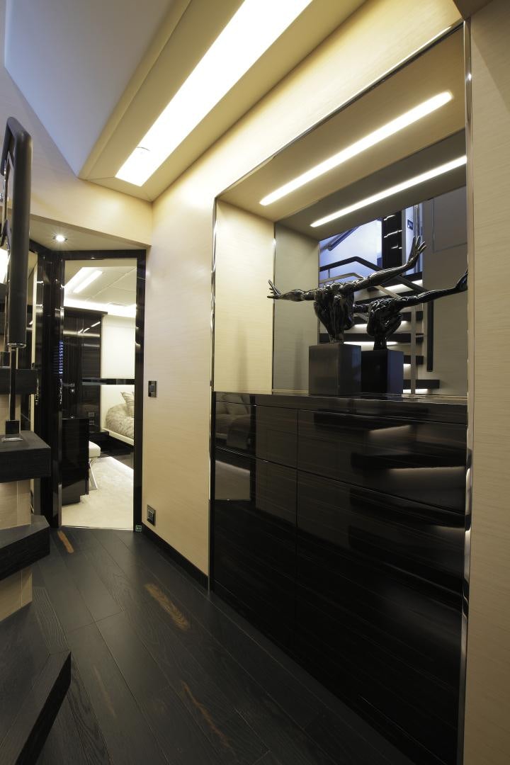 a room with a large mirror and a counter with a sink and a large mirror aboard NOVASTAR Yacht for Sale