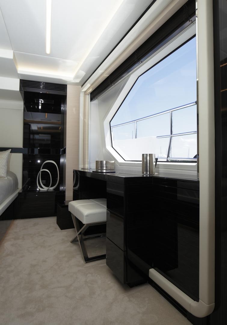 a room with a desk and a window aboard NOVASTAR Yacht for Sale