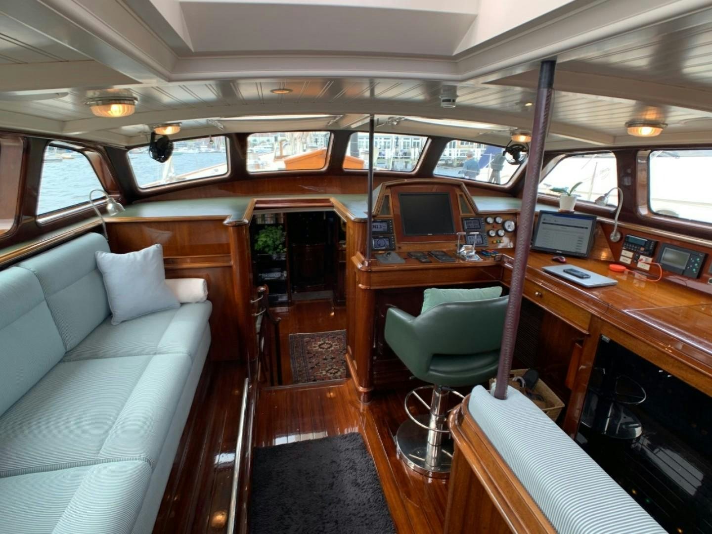a train car with a desk and a couch aboard CARMELLA  Yacht for Sale