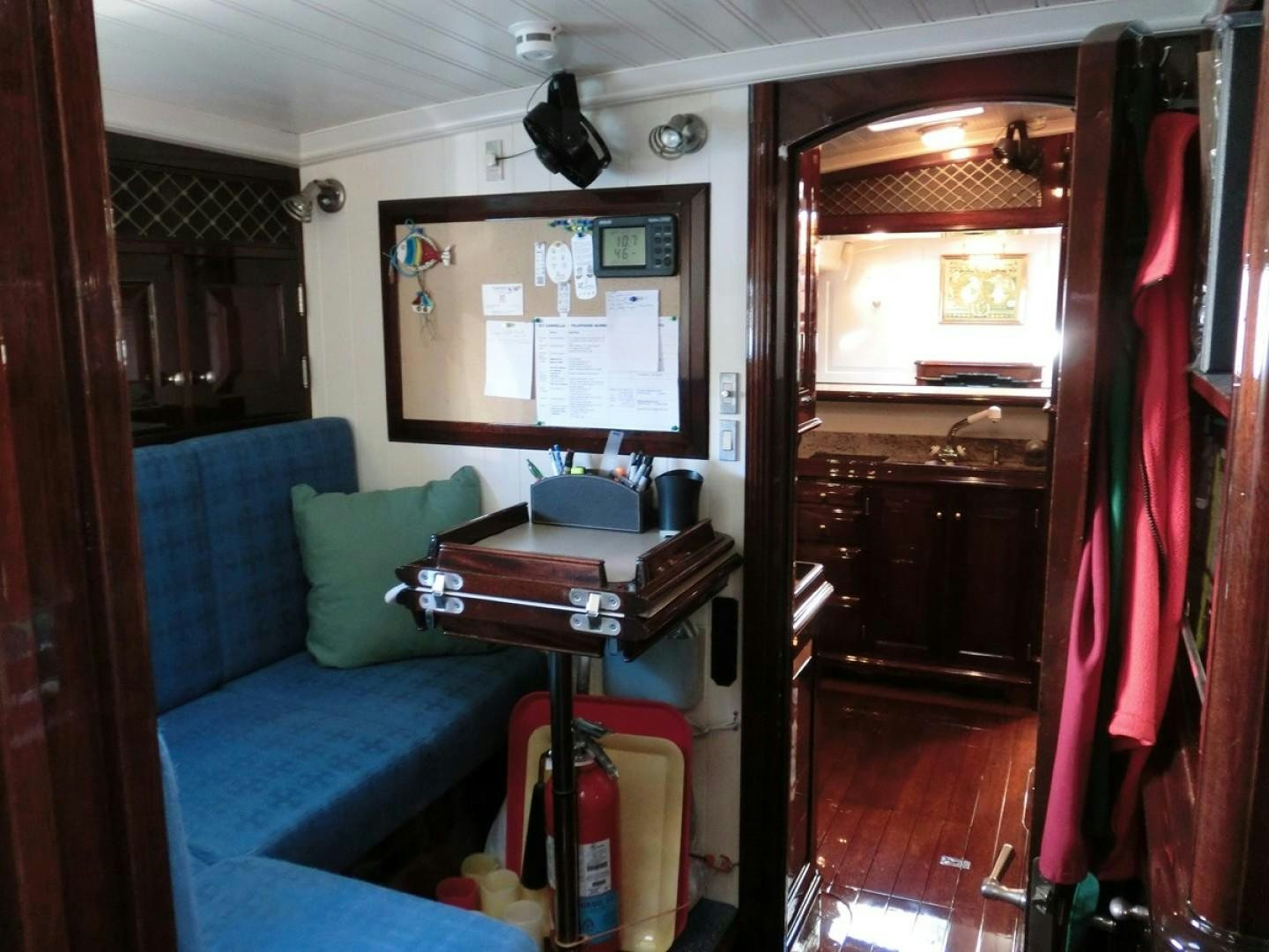 a living room with a blue couch aboard CARMELLA  Yacht for Sale