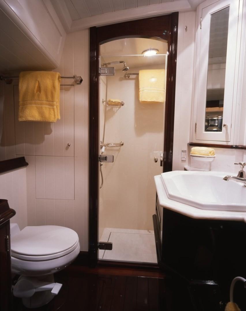a bathroom with a shower and toilet aboard CARMELLA  Yacht for Sale