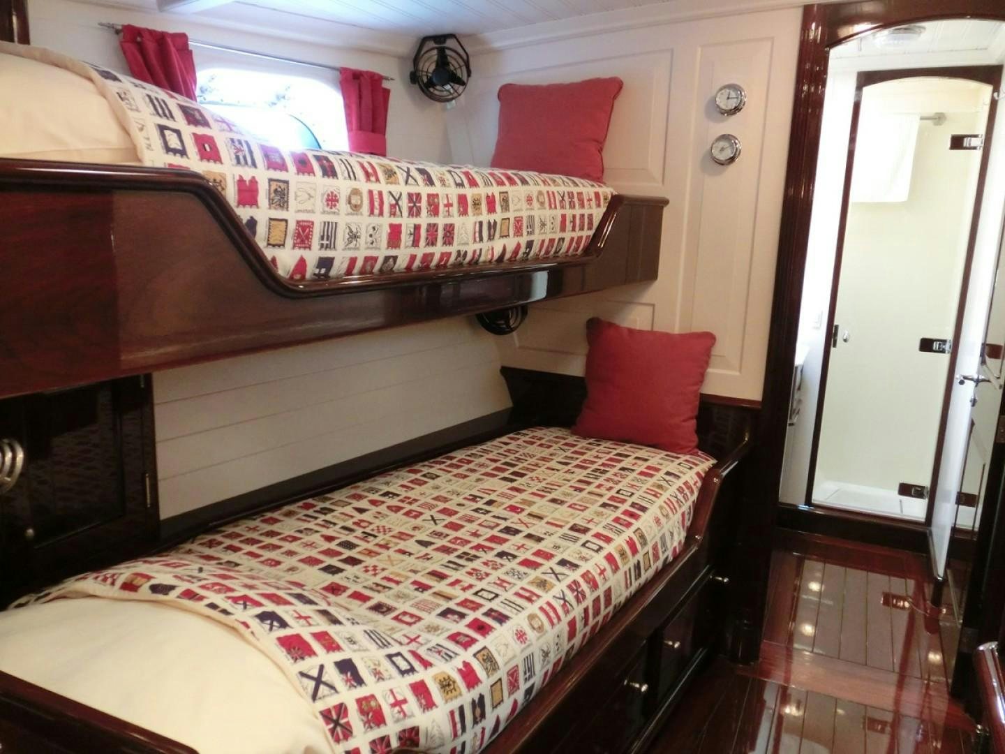 a double bed in a room aboard CARMELLA  Yacht for Sale