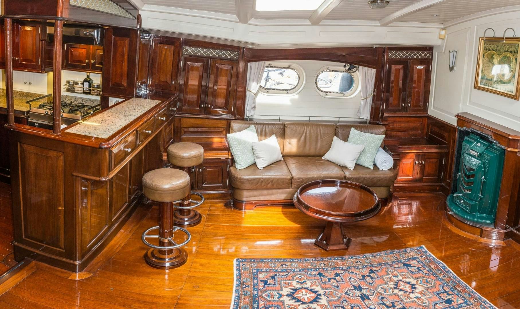 a living room with a couch and a table aboard CARMELLA  Yacht for Sale