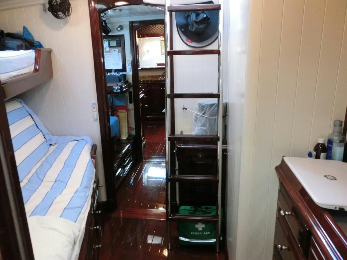 a room with a bed and a closet aboard CARMELLA  Yacht for Sale