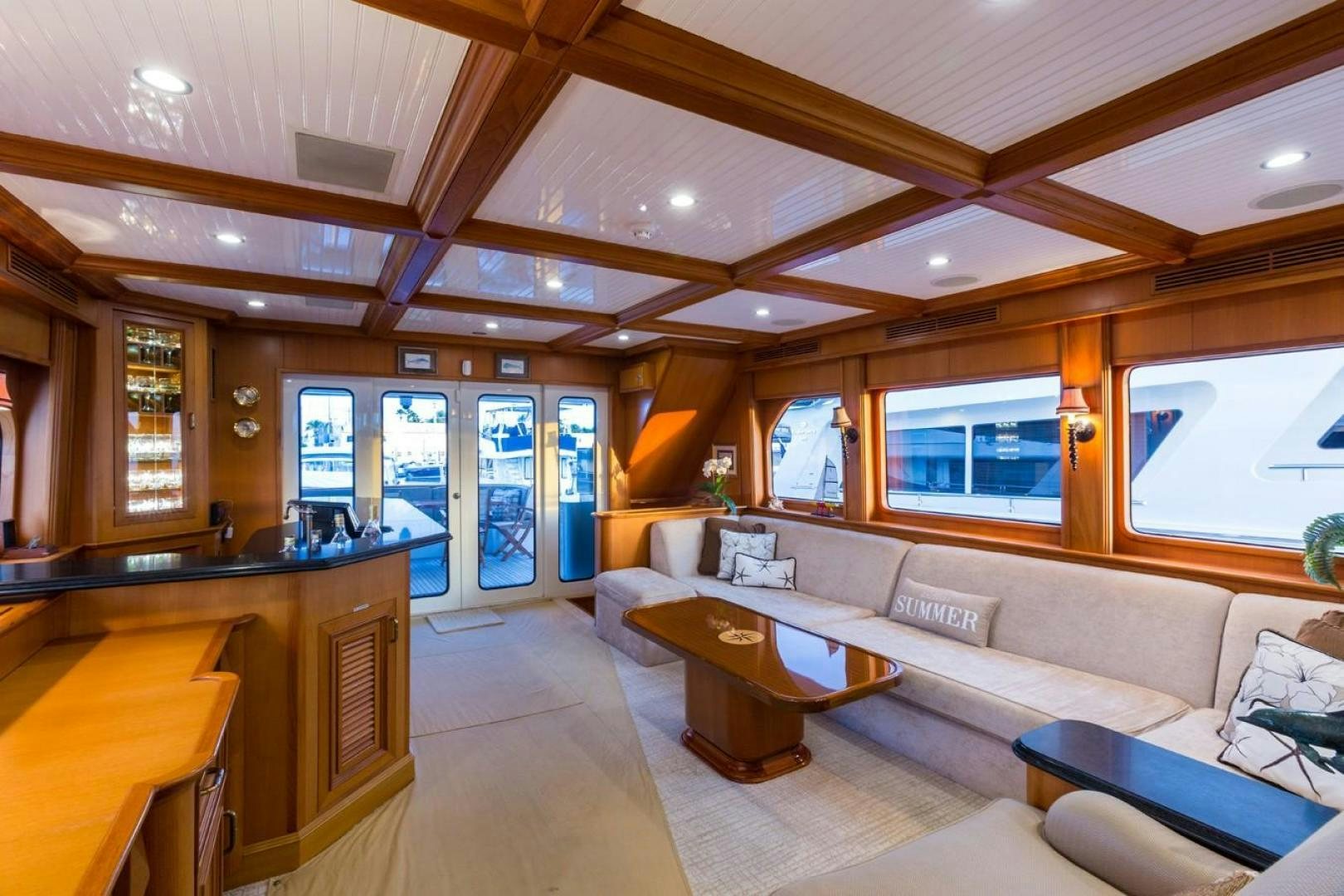 a room with a couch and a table aboard DEAL MAKER Yacht for Sale