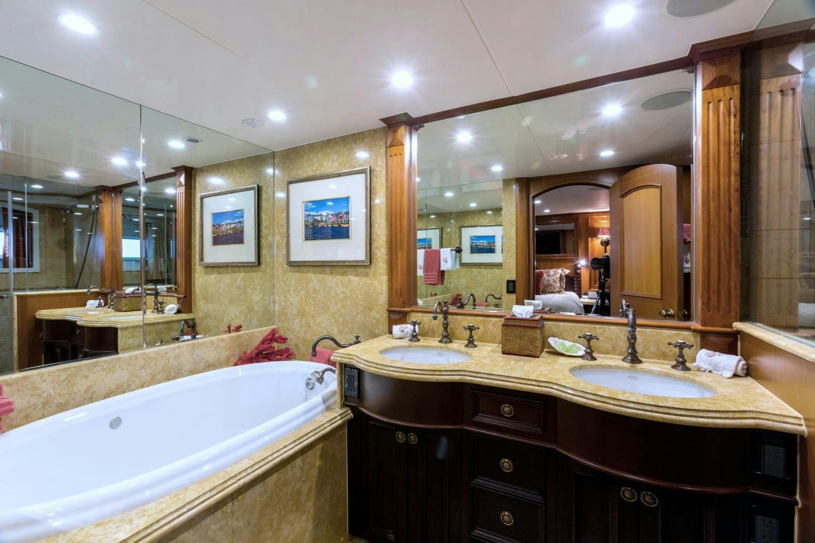 a bathroom with a large mirror aboard DEAL MAKER Yacht for Sale