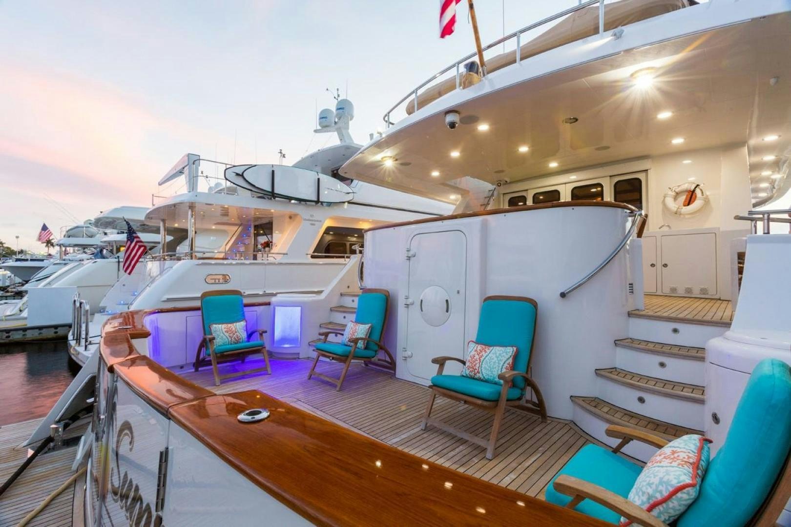 a boat with chairs on the deck aboard DEAL MAKER Yacht for Sale