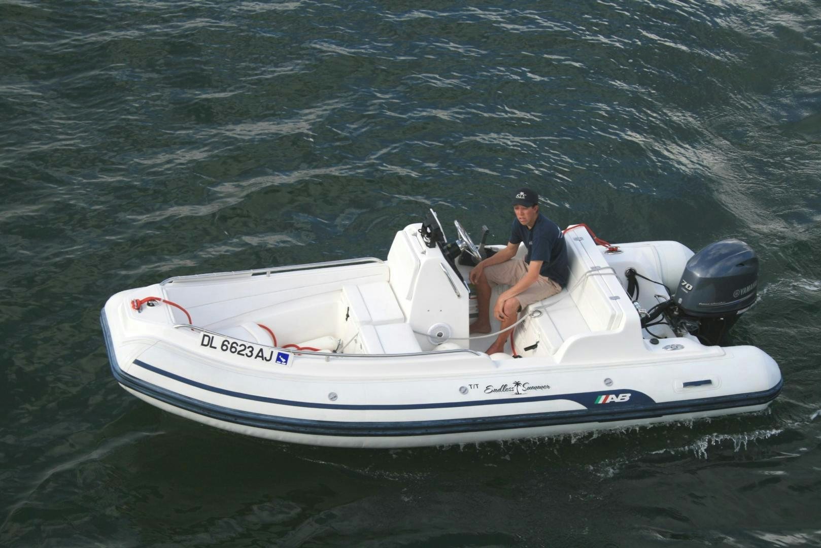 a man on a boat aboard DEAL MAKER Yacht for Sale