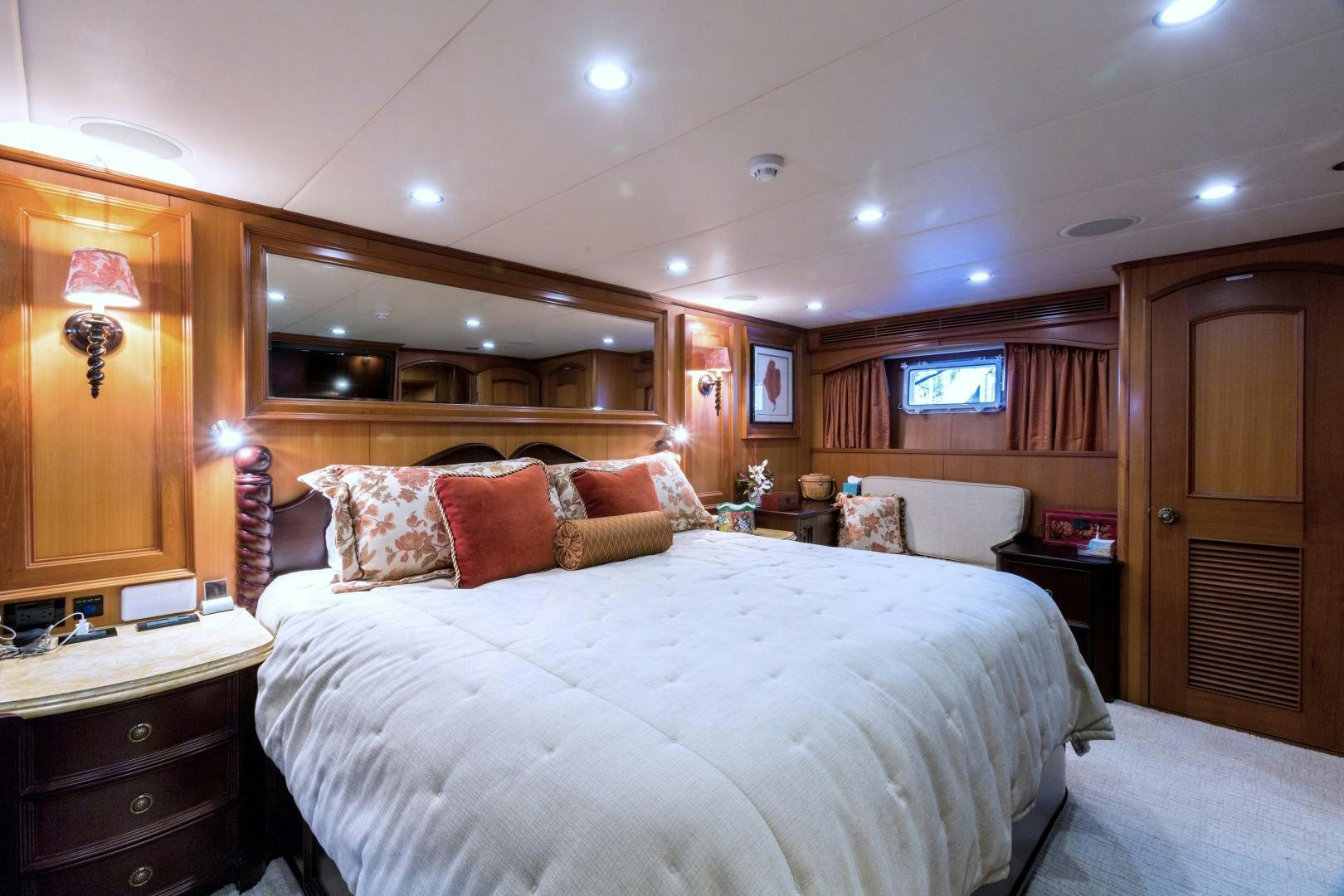 a bedroom with a bed and a desk aboard DEAL MAKER Yacht for Sale