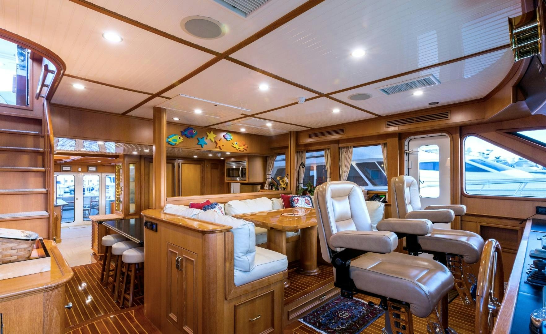 a room with a bed and desk aboard DEAL MAKER Yacht for Sale