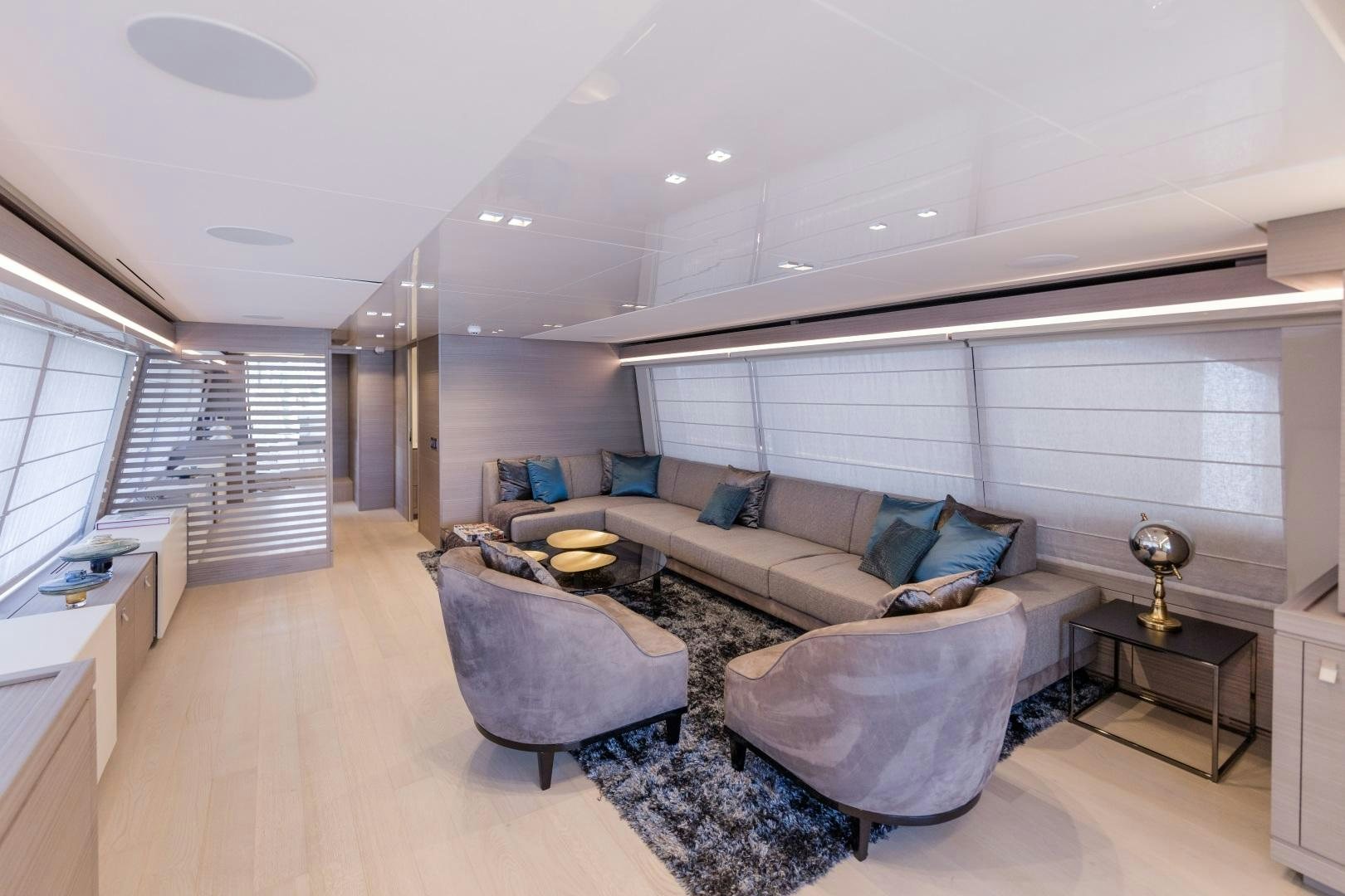 a living room with a couch and a table aboard BONUS ROUND Yacht for Sale