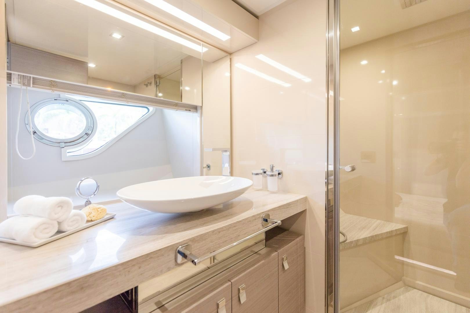 a bathroom with a sink and a bathtub aboard BONUS ROUND Yacht for Sale