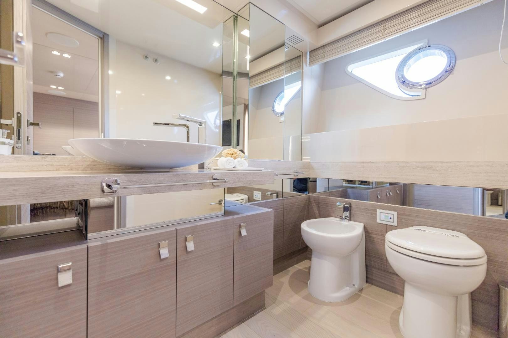 a bathroom with a large mirror aboard BONUS ROUND Yacht for Sale