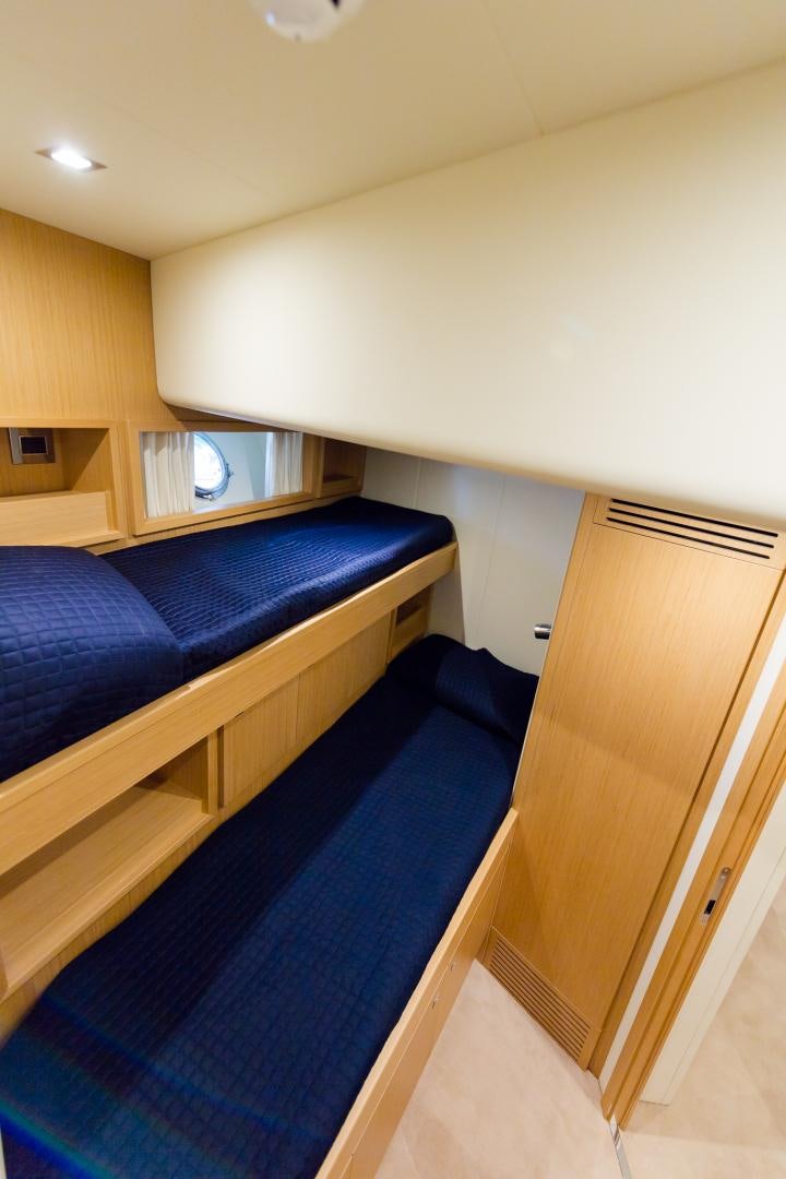 a bed in a room aboard BONUS ROUND Yacht for Sale