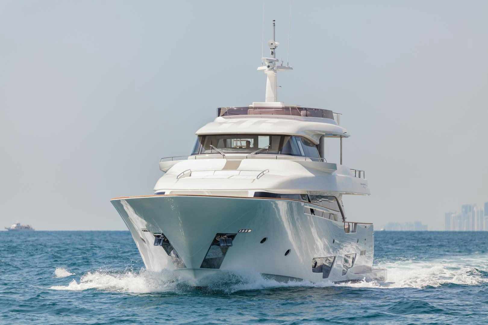 a white boat in the water aboard BONUS ROUND Yacht for Sale