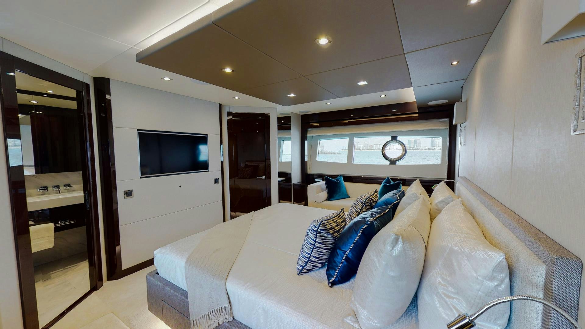 a white couch in a room aboard PV 95 Yacht for Sale