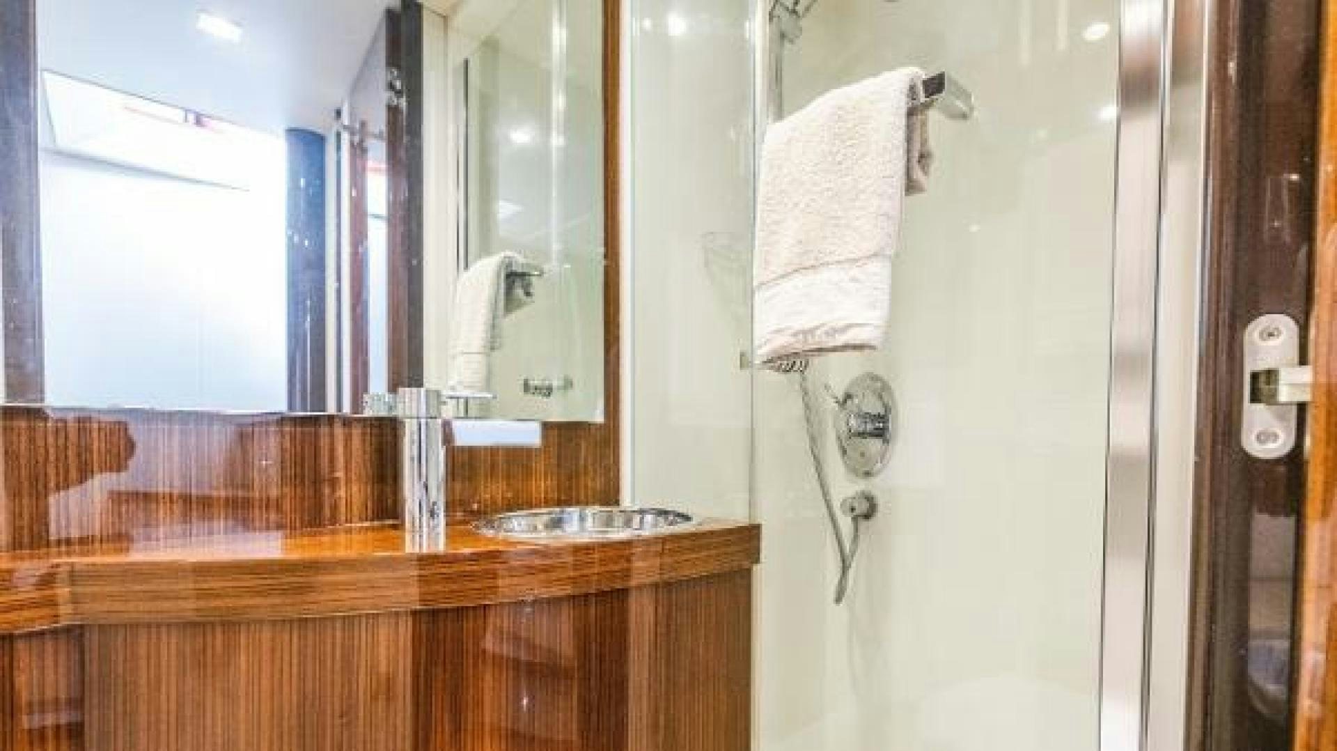 a bathroom with a sink and a towel on the wall aboard Z Yacht for Sale
