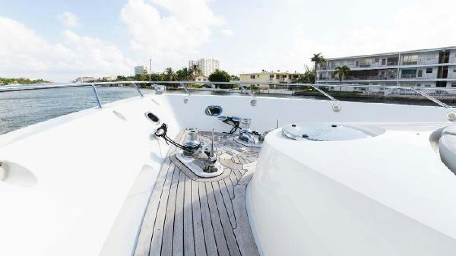 a white boat with a sink and a faucet on a dock aboard Z Yacht for Sale
