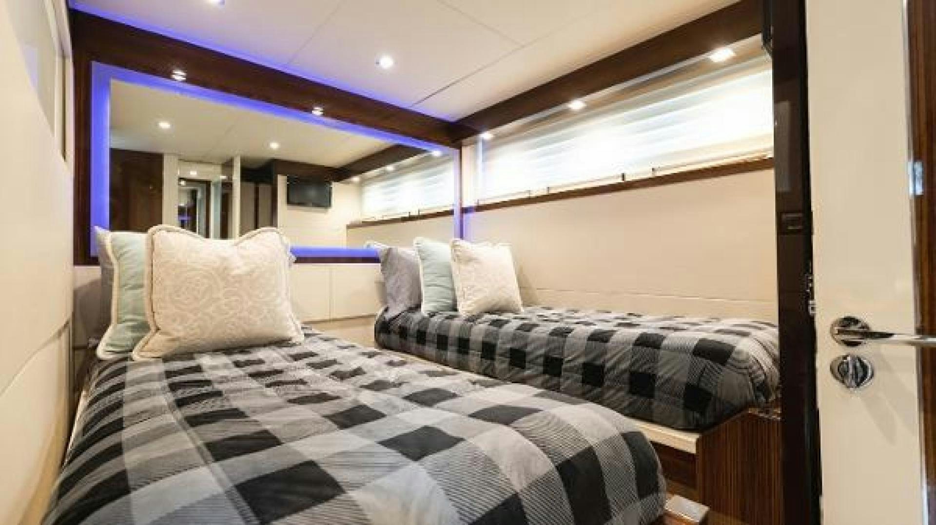 a bedroom with a double bed aboard Z Yacht for Sale