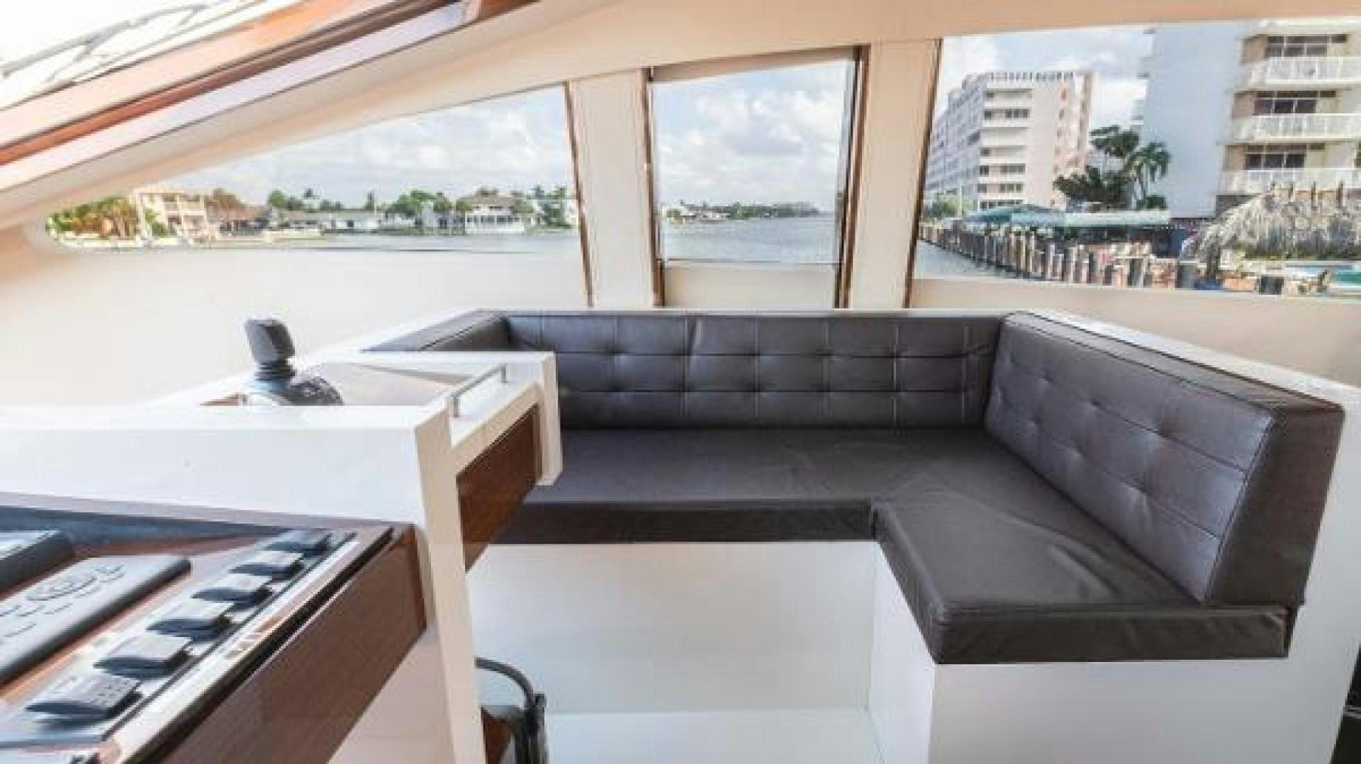a room with a couch and a desk aboard Z Yacht for Sale