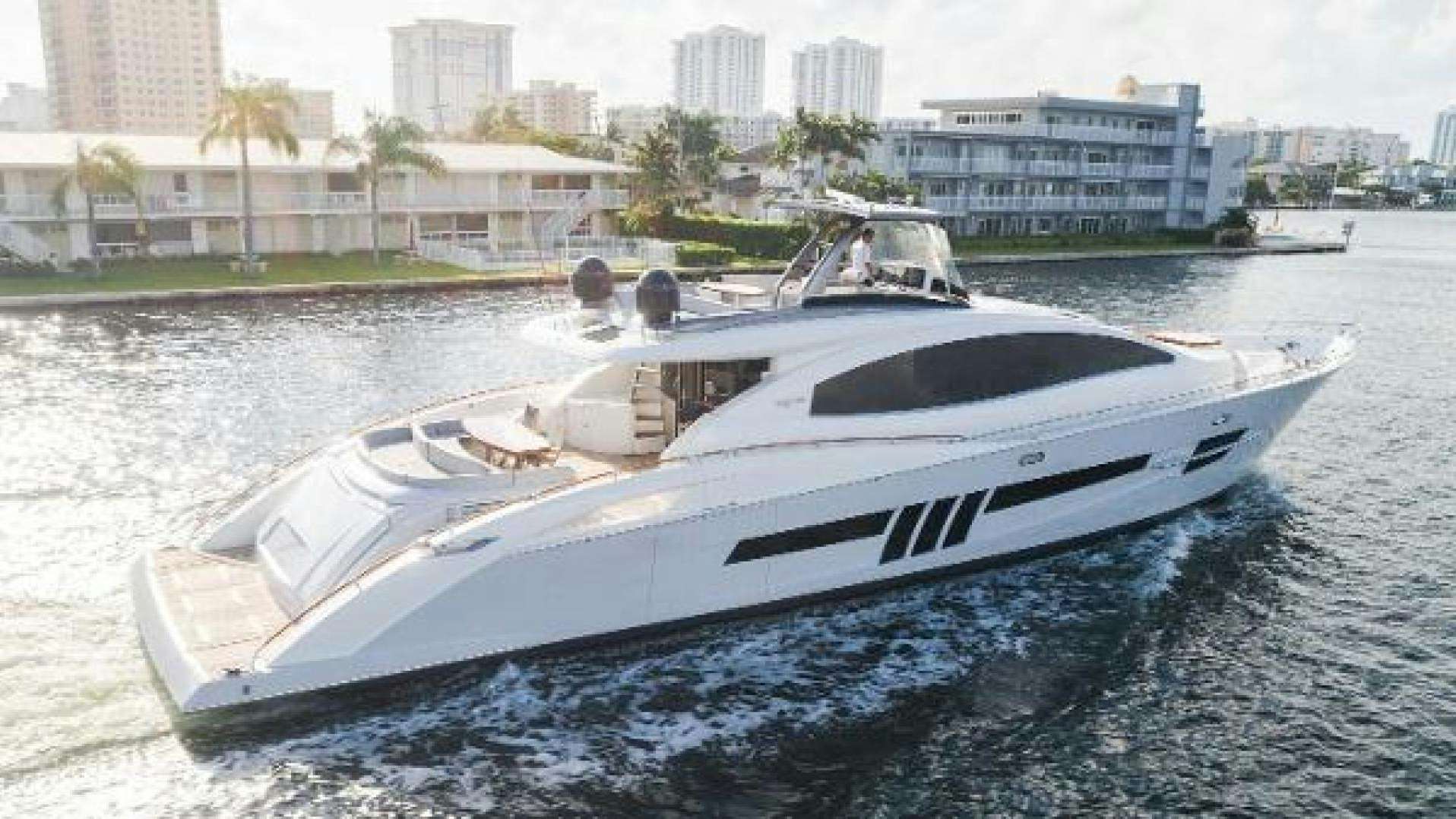 a white yacht on the water aboard HELIOS Yacht for Sale