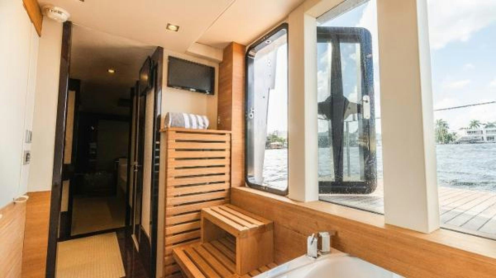 a room with a sink and a tv on the wall aboard Z Yacht for Sale