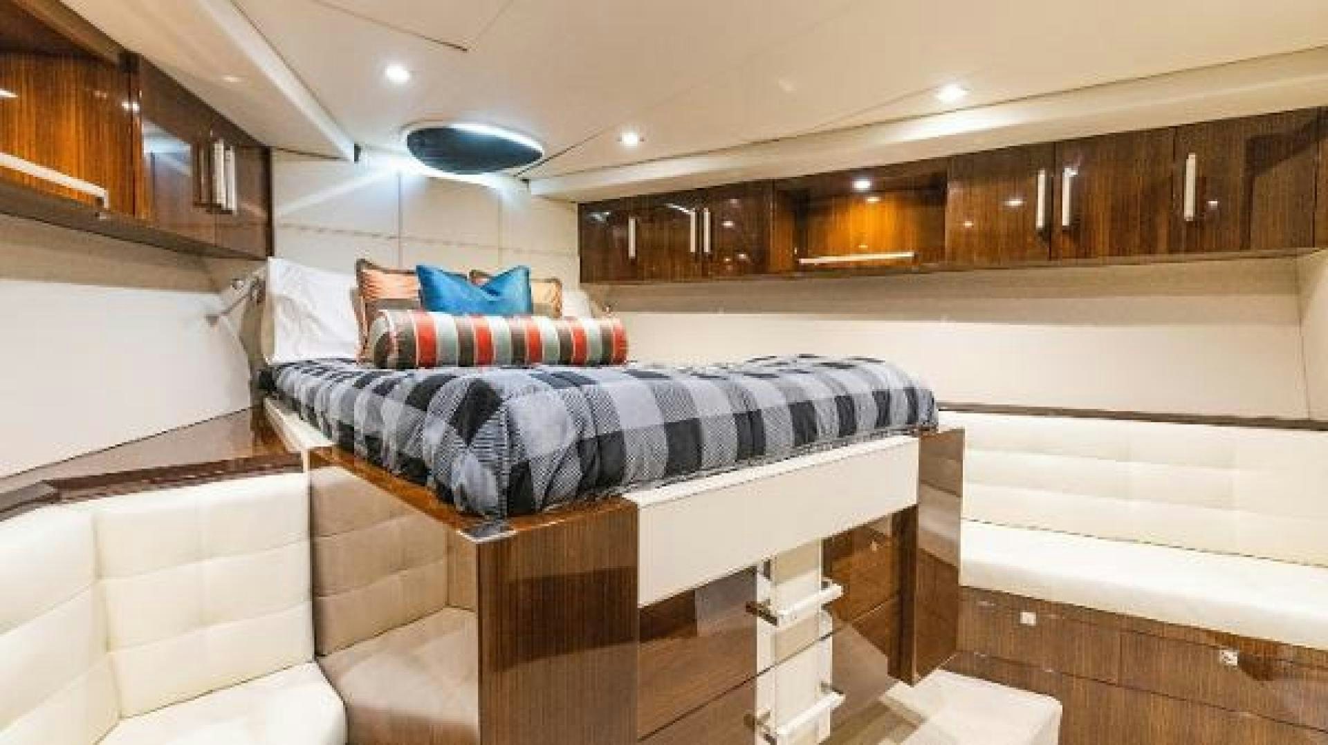 a room with a bed and a table aboard Z Yacht for Sale