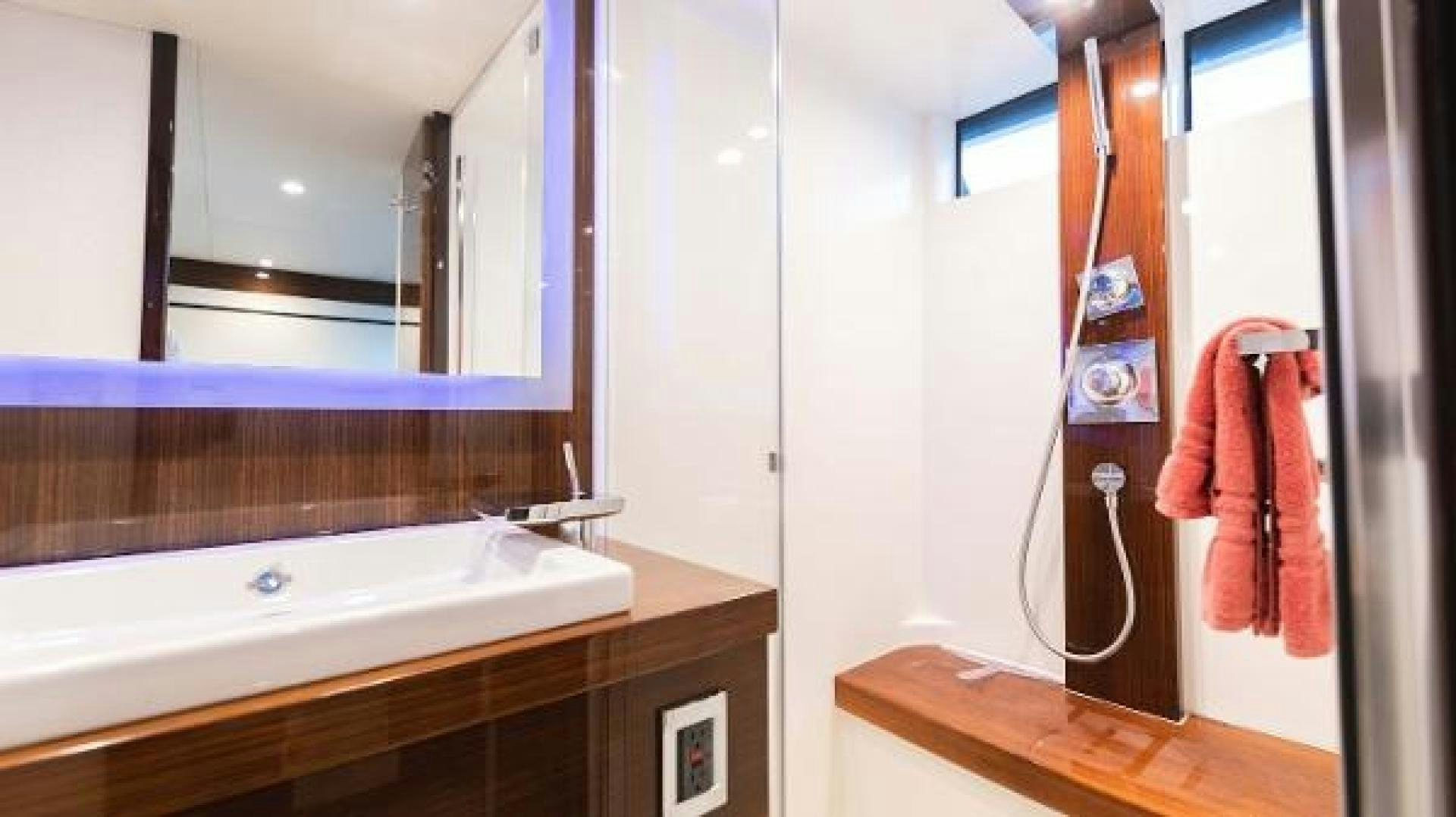 a bathroom with a sink and mirror aboard Z Yacht for Sale