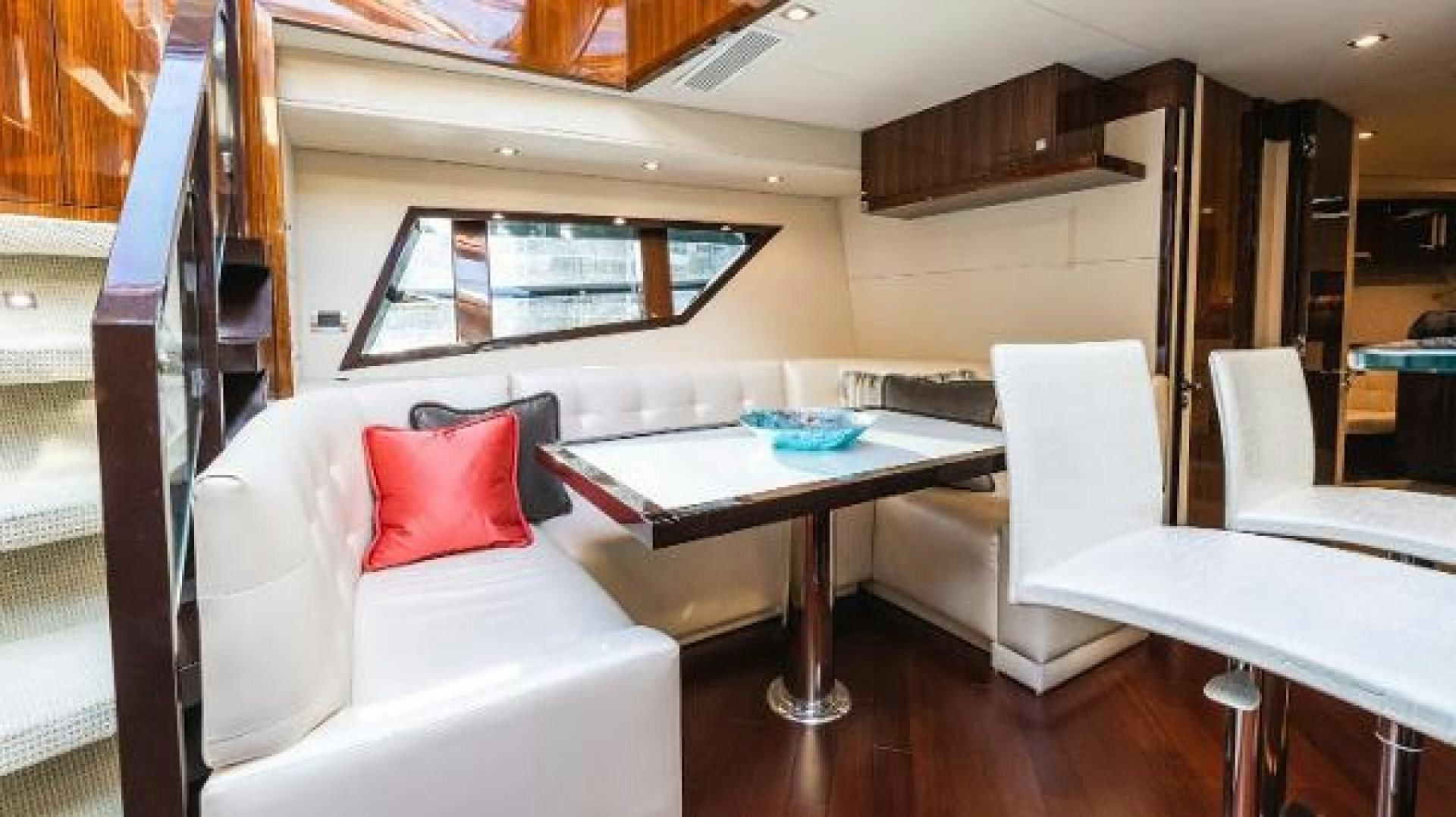 a room with a table and chairs aboard Z Yacht for Sale