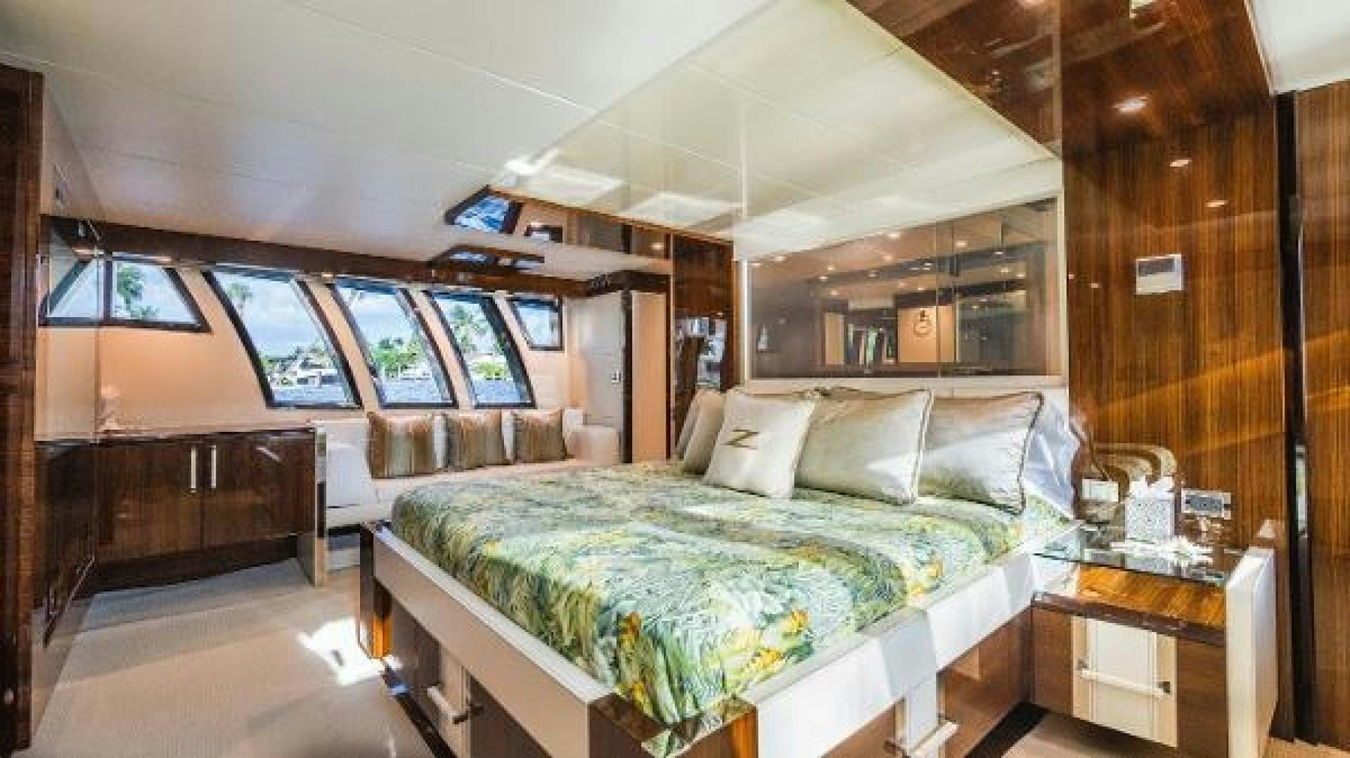 a room with a bed and a desk aboard Z Yacht for Sale