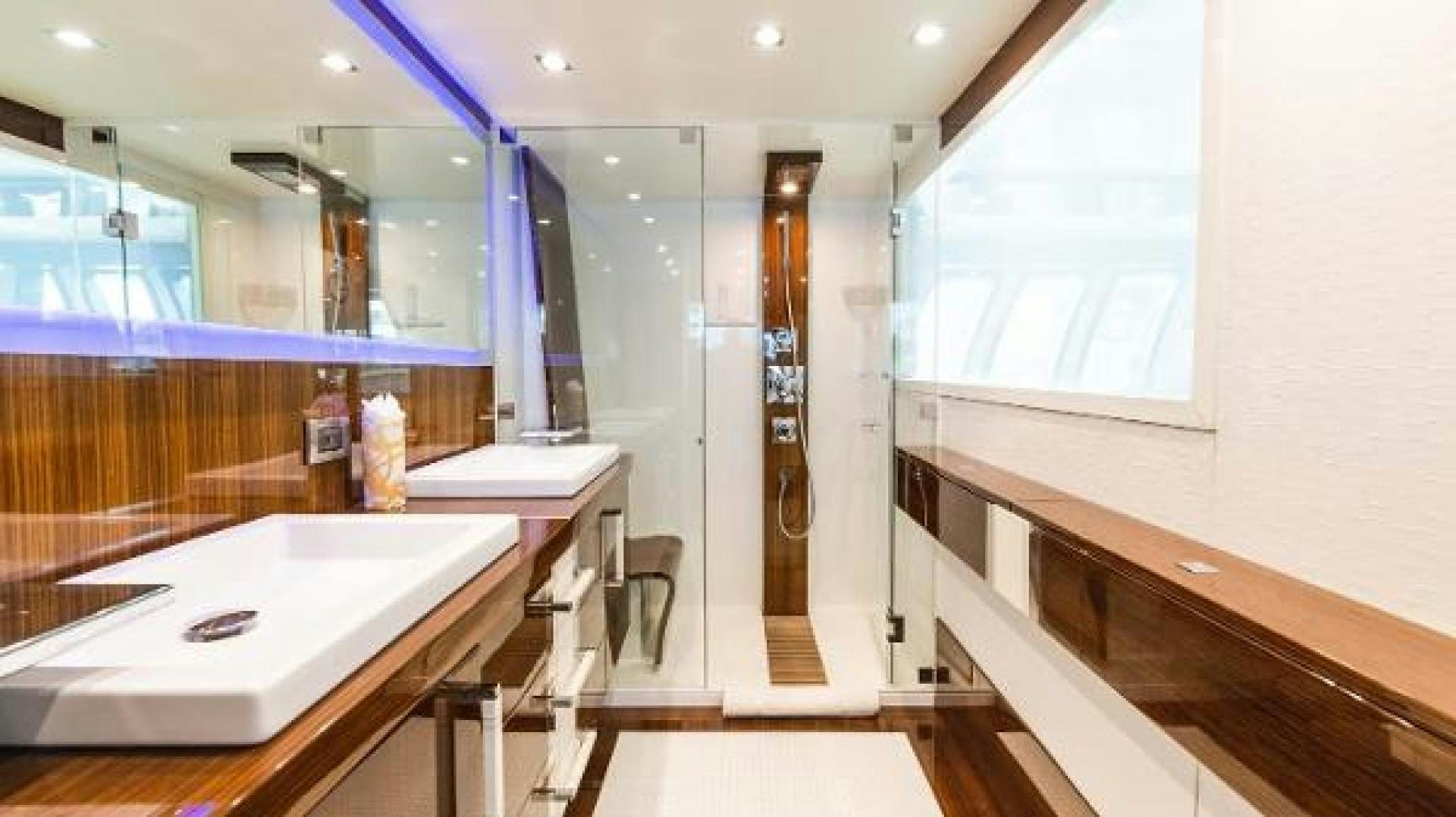 a bathroom with a countertop sink and a mirror aboard Z Yacht for Sale