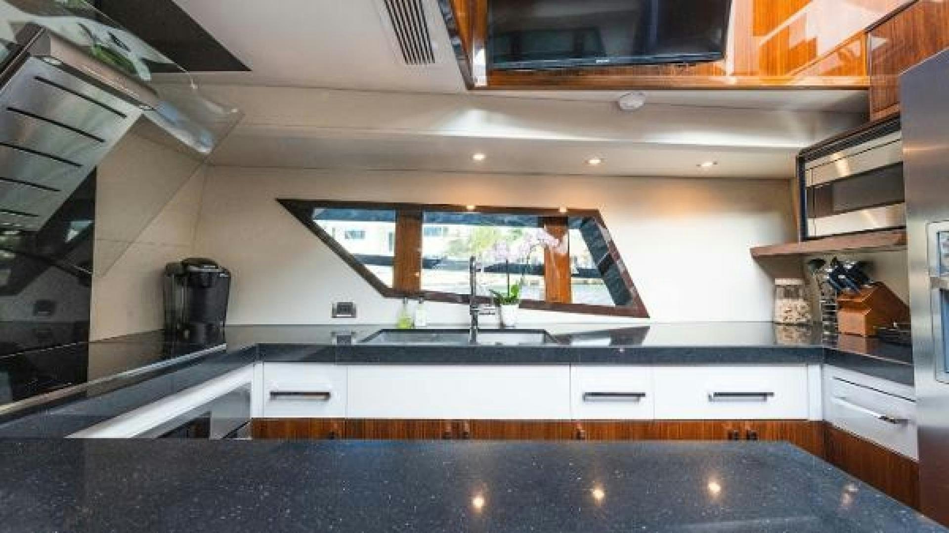 a kitchen with a glass window aboard Z Yacht for Sale