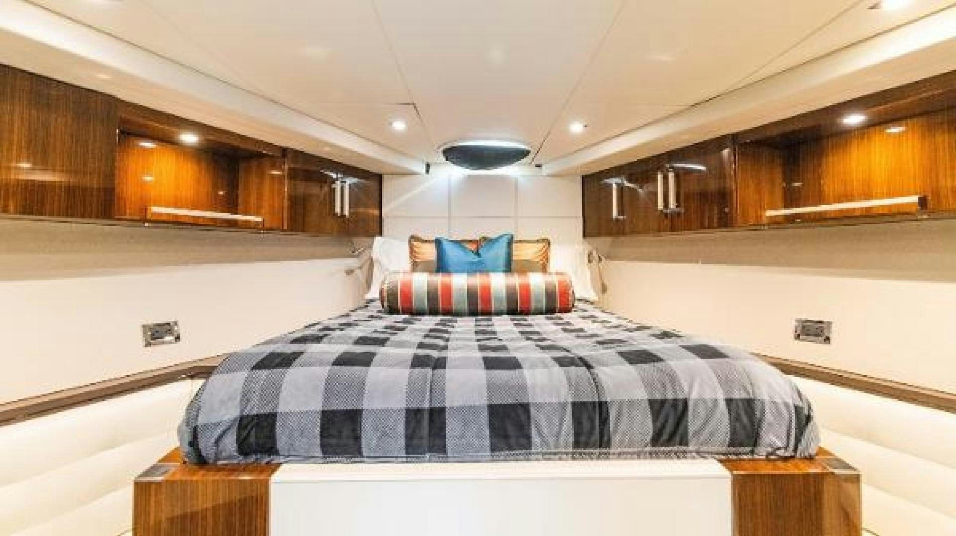 a large bedroom with a bed aboard Z Yacht for Sale